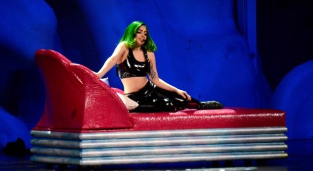 lady gaga sits on red couch at artrave